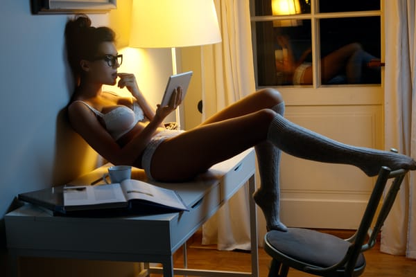 sexy women in lingerie watching erotic movies